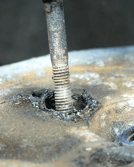 Unscrewing a stuck bolt with a worn head in the hole