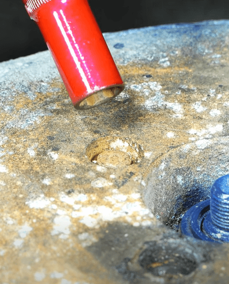 Unscrewing a stuck bolt with a worn head in the hole